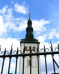 Low angle view of building against cloudy sky