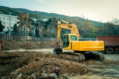 Yellow bulldozer at construction site