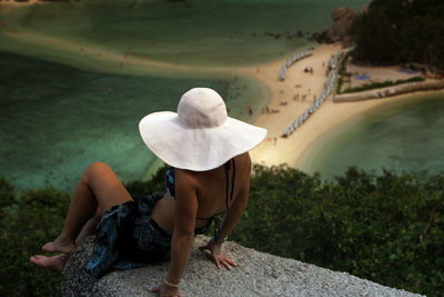 Rear view of woman looking at beach