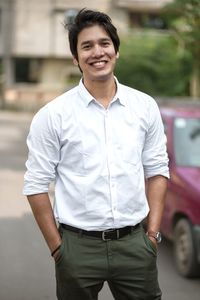 Portrait of young man standing outdoors