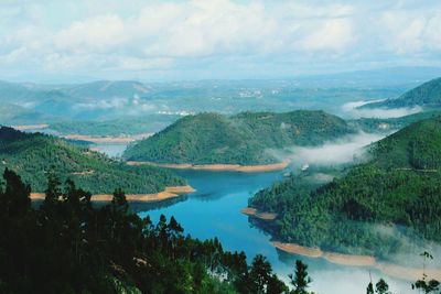 Scenic view of lake with mountains in background