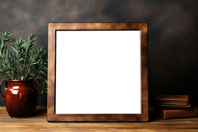 Close-up of empty picture frame on table