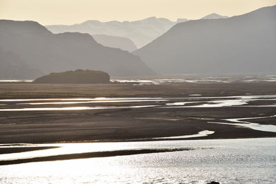 Scenic view of beach against mountains