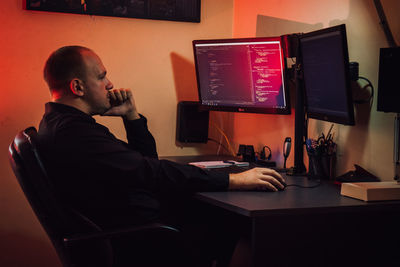 Man sitting on table at home