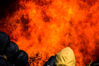 Firefighter against orange fire