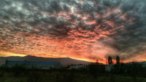 Scenic view of landscape against cloudy sky