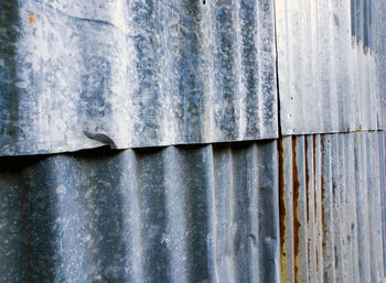 Rusty corrugated galvanized sheet iron fence