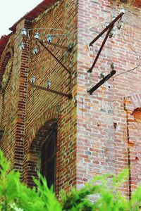 Low angle view of brick wall