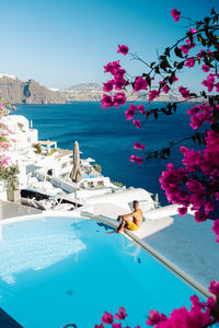 Scenic view of swimming pool by sea against sky