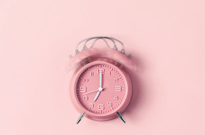 Close-up of clock over white background