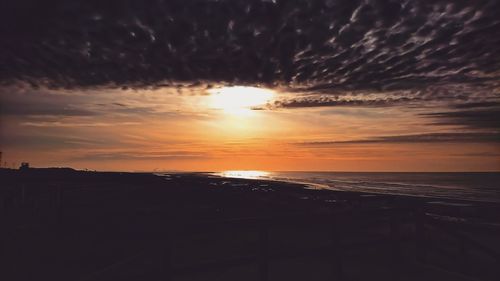 Scenic view of sea against sky at sunset