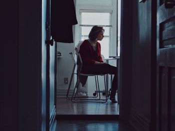 Man sitting on chair at home