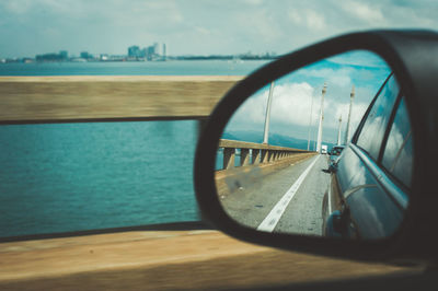 Reflection of car on side-view mirror