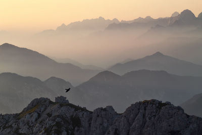 Scenic view of mountains against sky during sunset