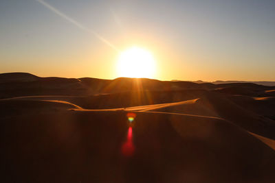 Scenic view of landscape against sky during sunset