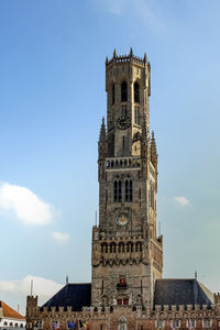 Low angle view of clock tower against the sky