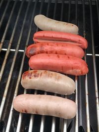 High angle view of meat on barbecue grill