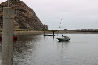 Boat sailing in sea against sky