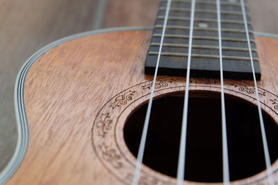 High angle view of guitar on table