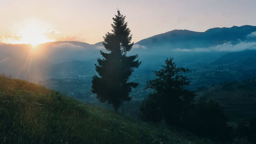 Scenic view of mountains against sky during sunset