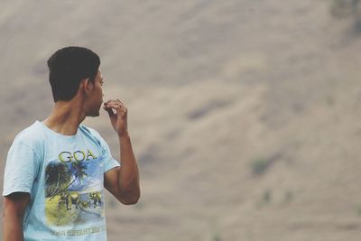 Young man standing outdoors