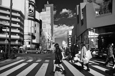 People walking on street in city