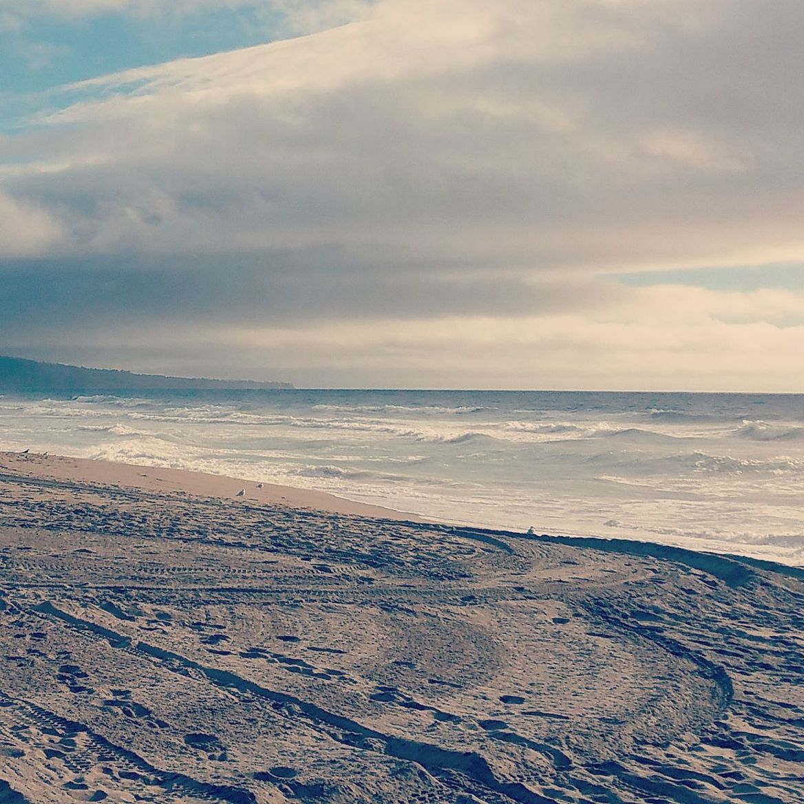 sea, beach, horizon over water, tranquil scene, sky, sand, scenics, water, tranquility, shore, beauty in nature, nature, cloud - sky, idyllic, wave, coastline, cloud, remote, cloudy, outdoors