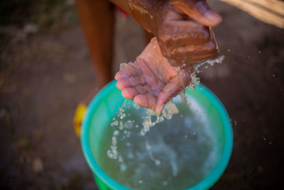 African woman washing her hands, covid-19 measures, corona virus conditions 