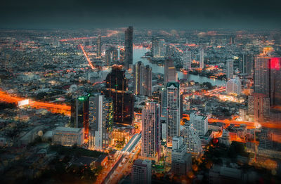 High angle view of illuminated buildings in city against sky