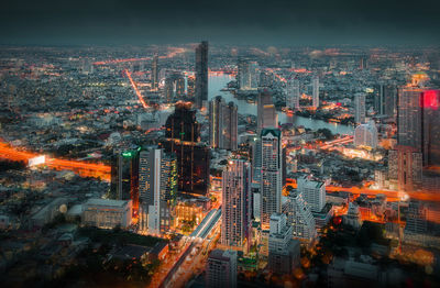 High angle view of illuminated buildings in city against sky