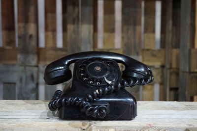 Close-up of telephone on table