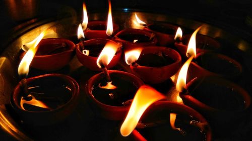 Close-up of lit tea light candles