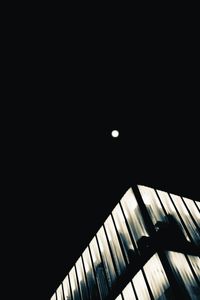 Low angle view of moon against sky at night