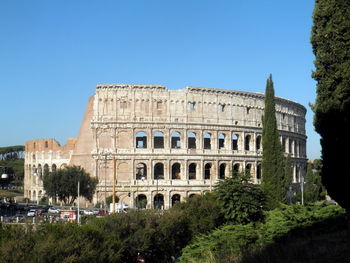 Low angle view of historical building against clear blue sky