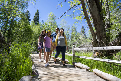 A family walks on a nature trail in south lake tahoe, ca