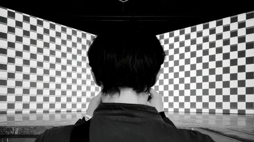 Close-up of woman standing against white background