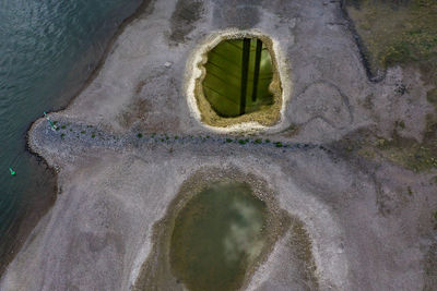High angle view of wall by sea
