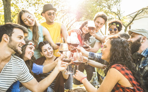 Group of young people drinking glass