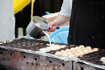 Man preparing food on barbecue grill