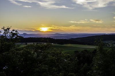 Scenic view of landscape against sky during sunset