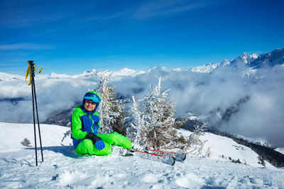 Rear view of woman skiing on snow