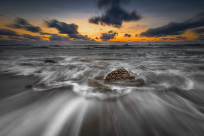 Scenic view of sea against sky during sunset