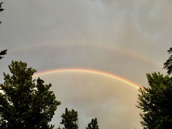 Low angle view of rainbow against sky