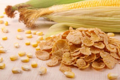 High angle view of corns and food on table