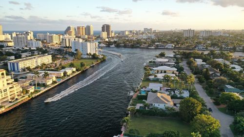 High angle view of river amidst buildings in city