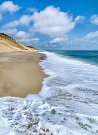 Scenic view of beach against sky