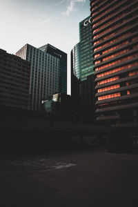 Low angle view of buildings against sky in city