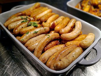 High angle shot of sausages on platter