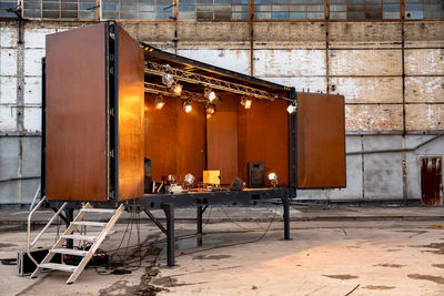 Illuminated stage in abandoned building