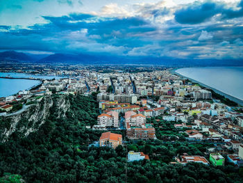 High angle view of townscape against cloudy sky